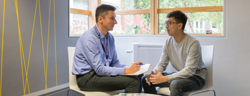 Student services advisor listening to a student during a support consultation